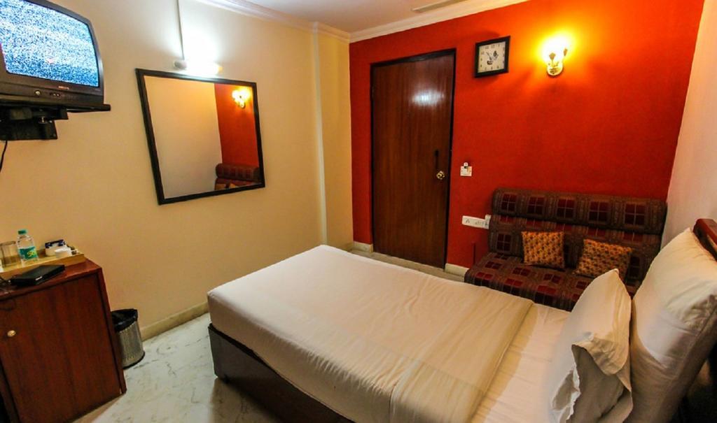 Hotel Pigeon International Μπανγκαλόρ Δωμάτιο φωτογραφία