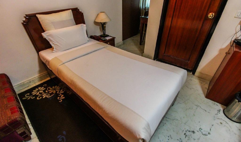 Hotel Pigeon International Μπανγκαλόρ Δωμάτιο φωτογραφία