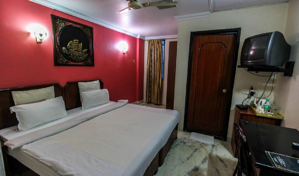 Hotel Pigeon International Μπανγκαλόρ Δωμάτιο φωτογραφία