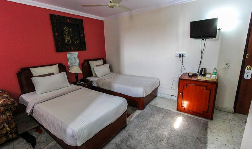 Hotel Pigeon International Μπανγκαλόρ Δωμάτιο φωτογραφία