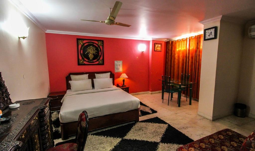 Hotel Pigeon International Μπανγκαλόρ Δωμάτιο φωτογραφία