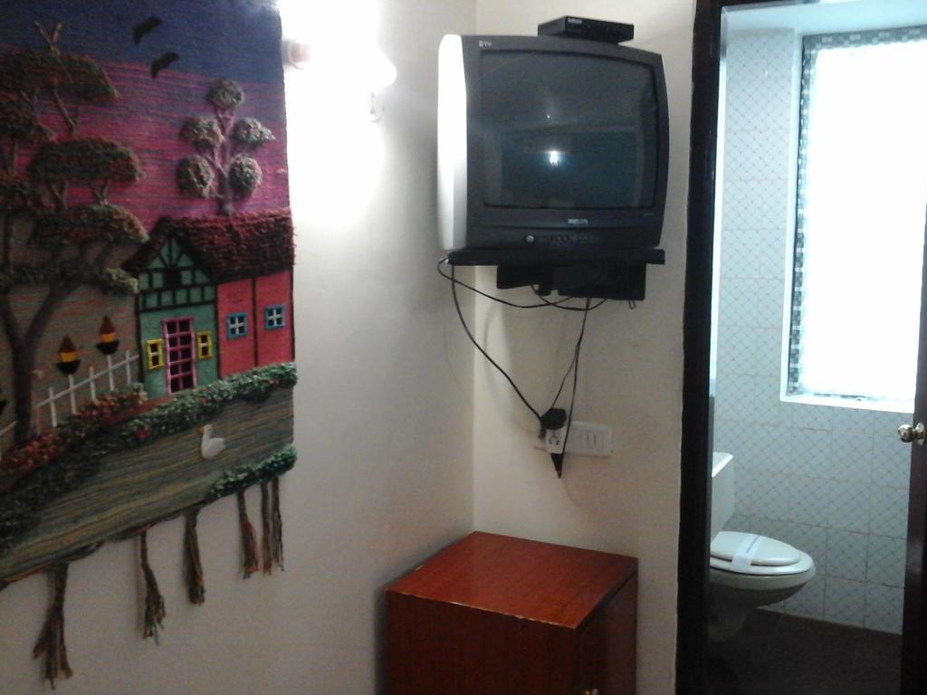 Hotel Pigeon International Μπανγκαλόρ Δωμάτιο φωτογραφία